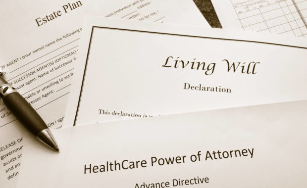 Wills and Trusts sitting on a desk with a pen, administering wills or trusts